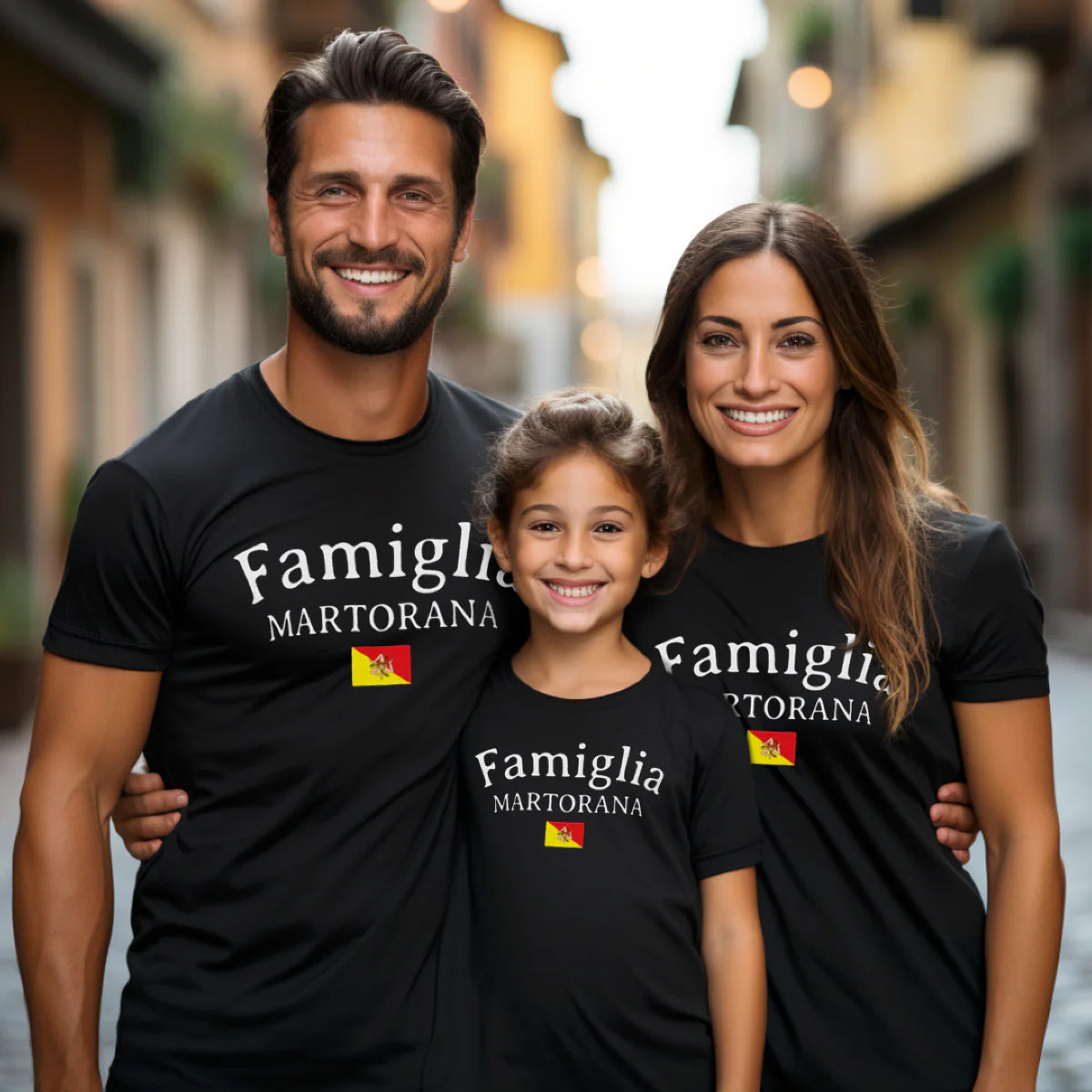 Family of three wearing black Famiglia personalized last name t-shirts with Sicilian flag icon - Sicilian family reunion trip apparel gift.