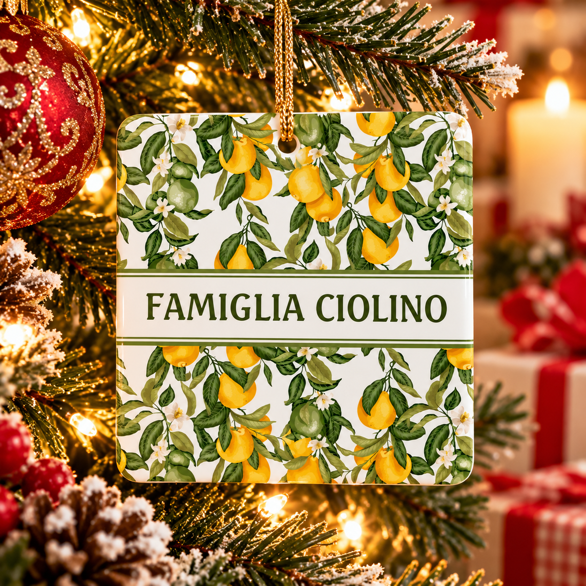 Personalized Famiglia (Last Name) ceramic Christmas ornament with Italian lemons hanging on a festive tree.