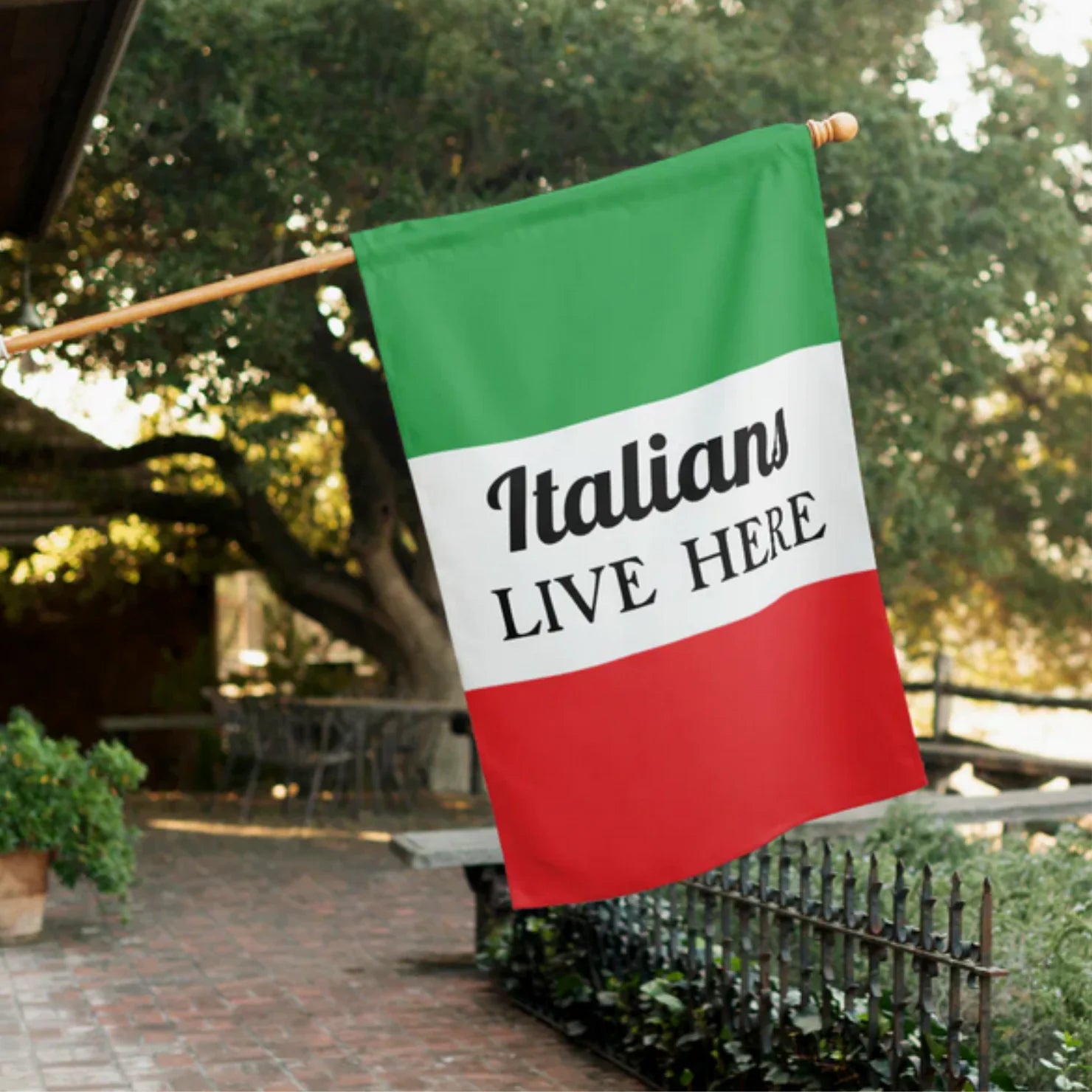 House flag with bold 'Italians Live Here' text and Flag of Italy. Funny Italian heritage home decor, housewarming gift, outdoor flag for Italian pride, and welcoming gift for Italian families.