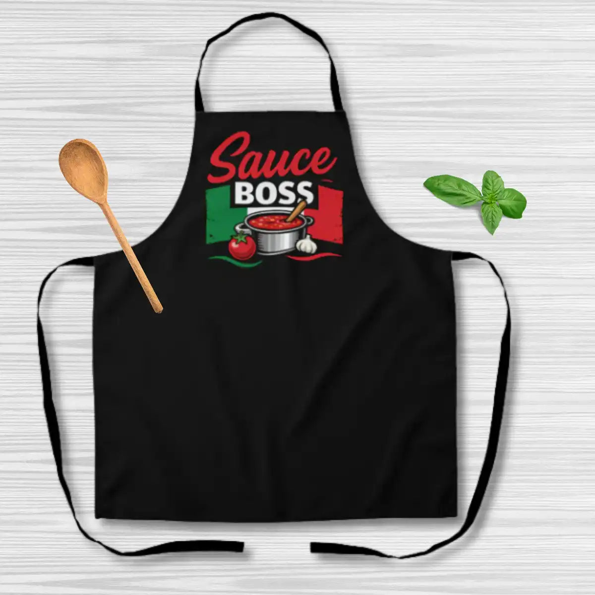 Black apron with 'Sauce Boss' and Italian flag design. Funny Italian heritage gift for him, gift for dad, housewarming gift, Christmas gift, and gift for Italian chef or home cook.