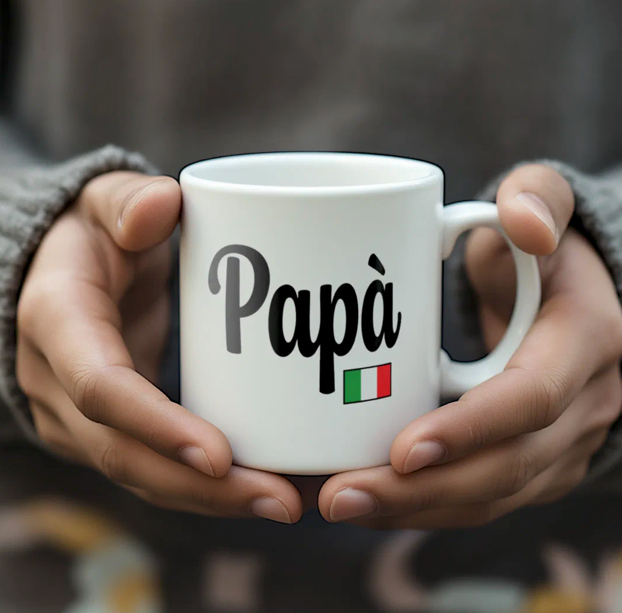 White mug with 'Papà' and Italian flag held by hands against a blurred background