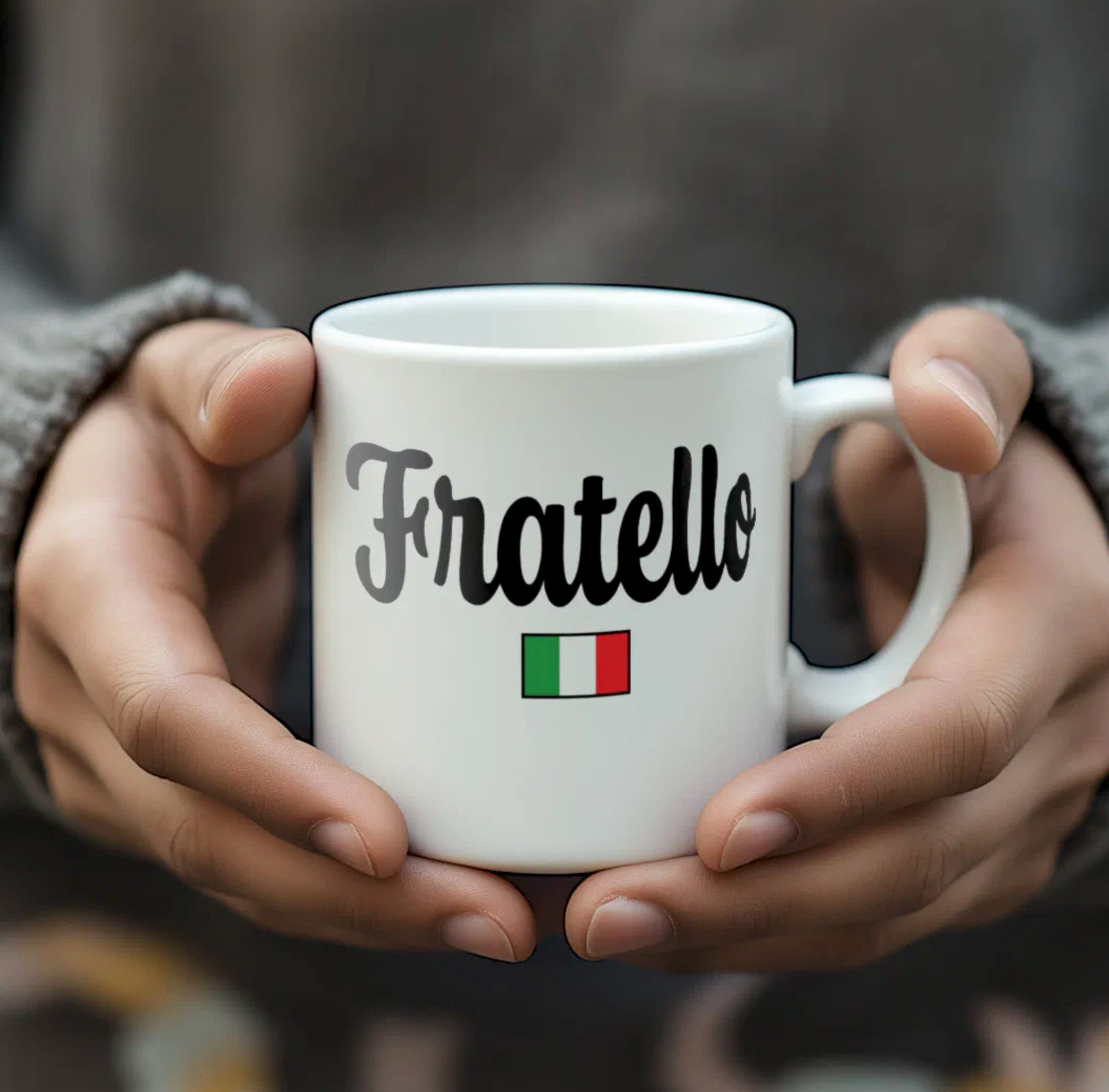 White mug with 'Fratello' and Italian flag held by hands against a blurred background