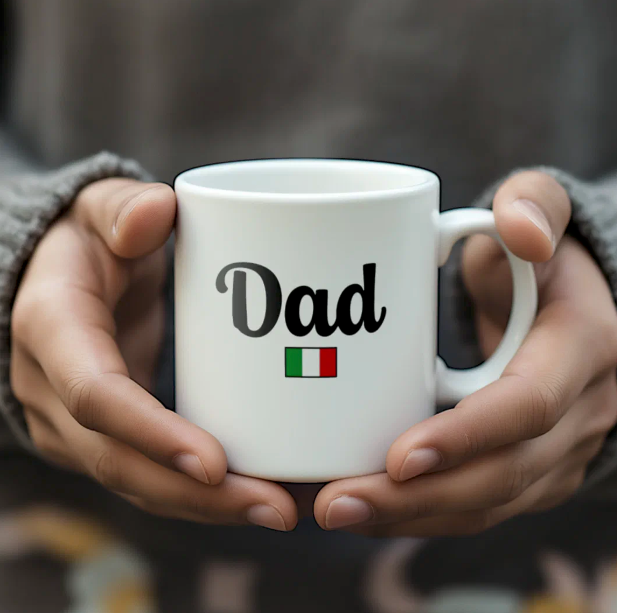 White mug with 'Dad' and Italian flag held by hands against a blurred background