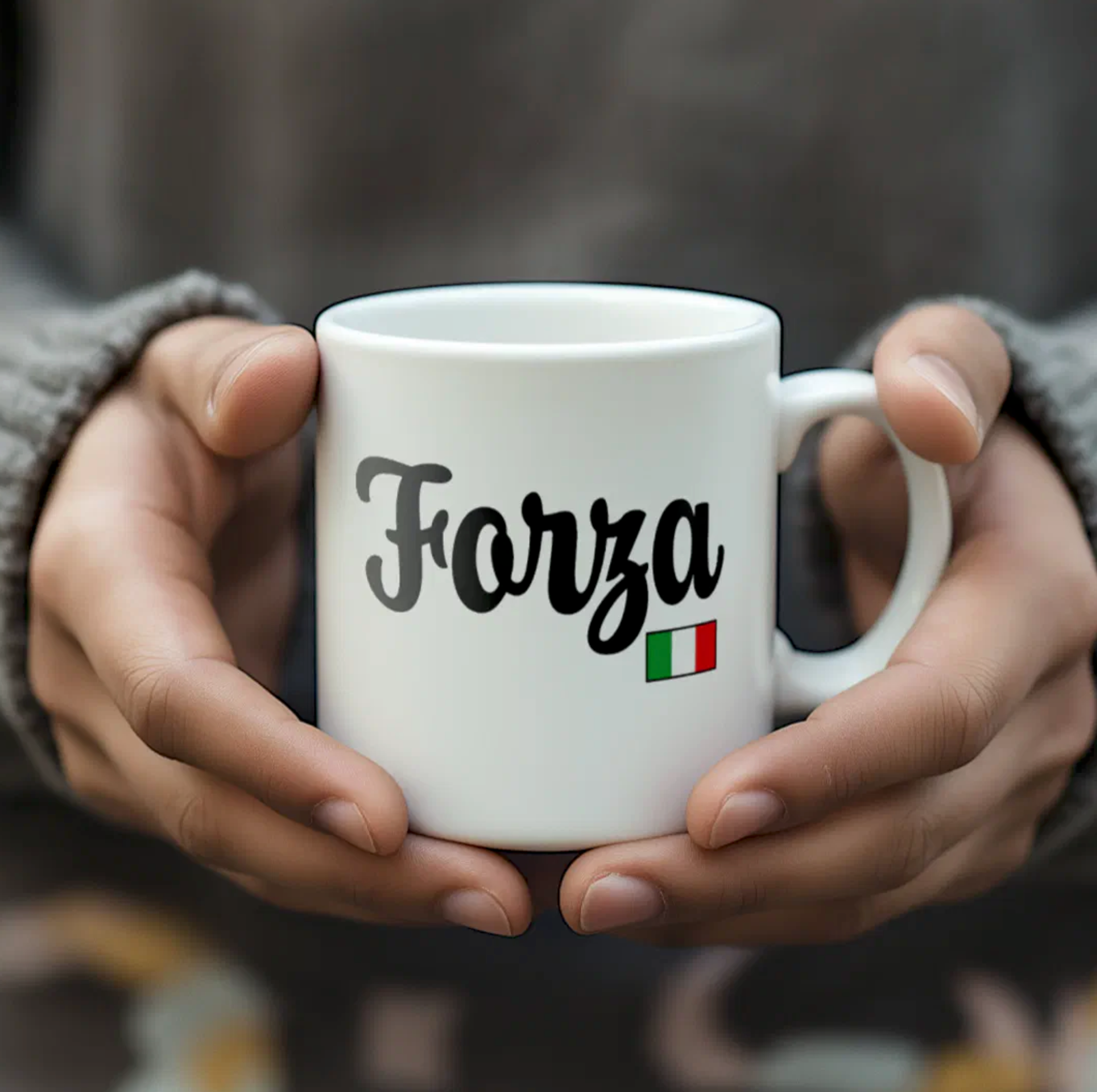 White mug with 'Forza' and Italian flag held by hands against a blurred background
