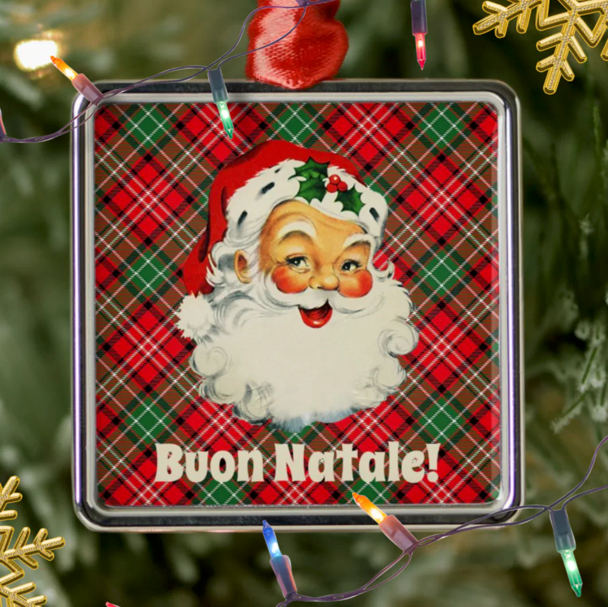 Christmas ornament with Santa Claus face and 'Buon Natale!' personalized text on a plaid background, surrounded by Christmas lights and decorations.
