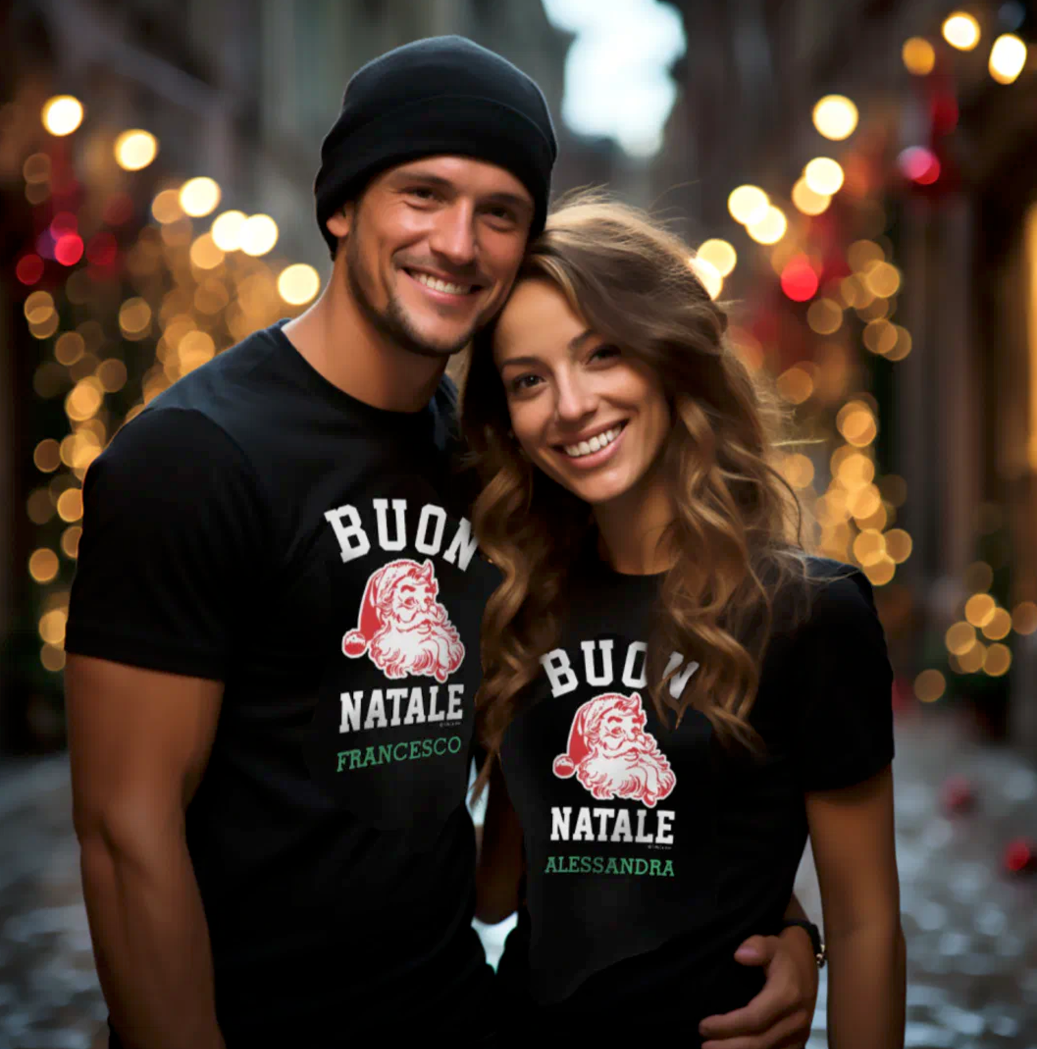 Two people wearing black t-shirts with 'Buon Natale' personalized text and Santa Claus graphic, standing in a festive outdoor setting.