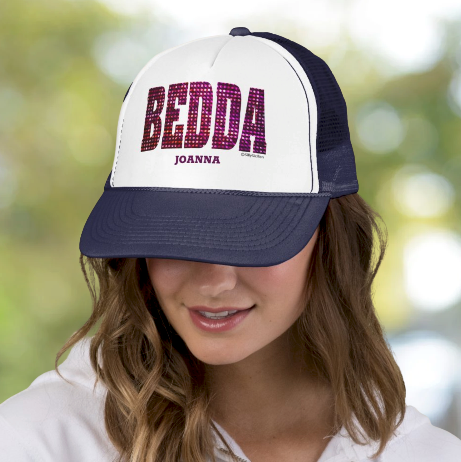 Person wearing a white and navy blue cap with 'BEDDA' and 'JOANNA' personalized text.