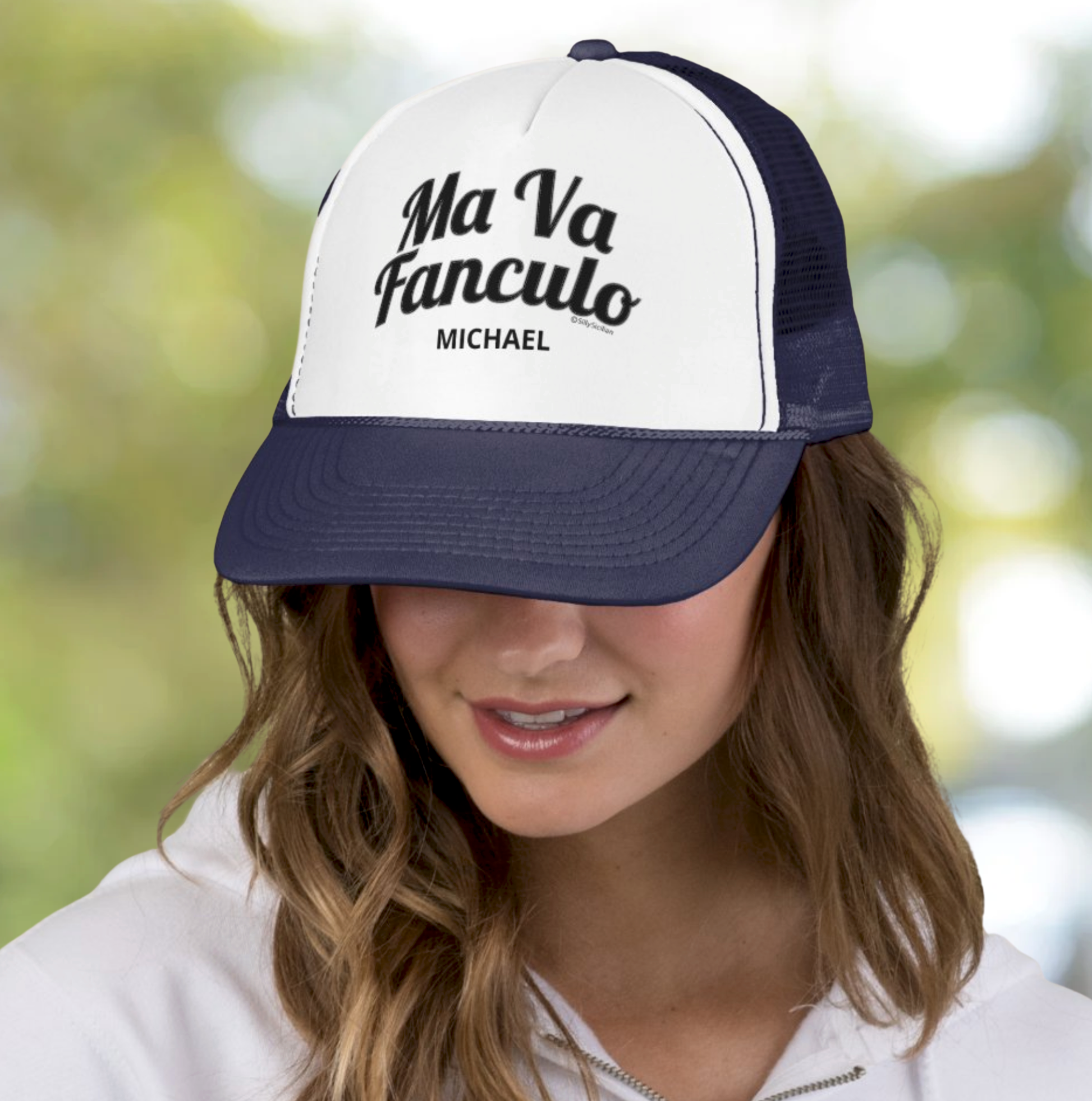 Person wearing a white and navy blue cap with 'Ma Va Fanculo Michael' personalized text gag gift.