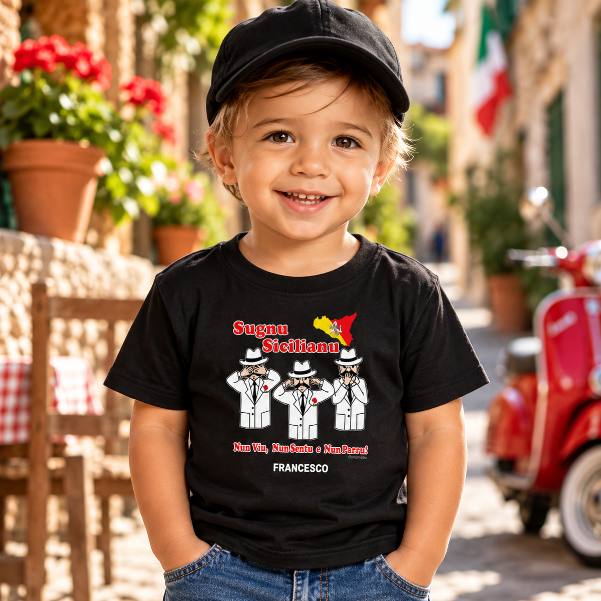 Smiling Italian boy wearing a personalized black “Sugnu Sicilianu” (I'm Sicilian) T-shirt with three Sicilian wise guys and the name Francesco.