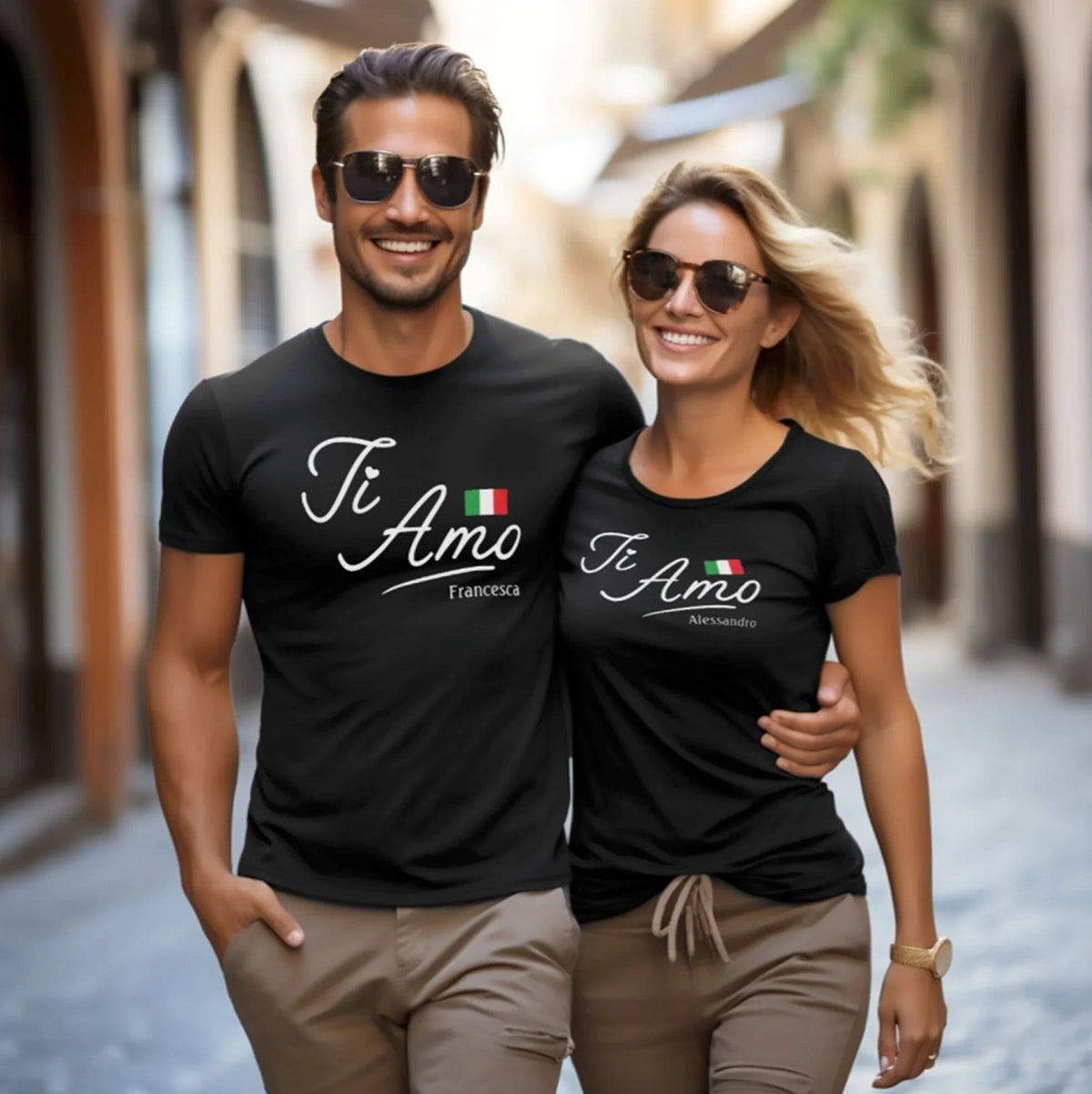 Man and woman walking together wearing matching personalized black t-shirts with 'Ti Amo' text.