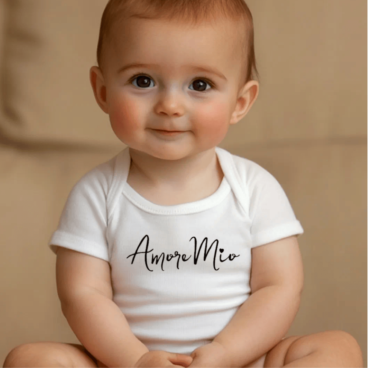 Baby wearing a white onesie with 'Amore Mio' text - Italian heritage baby shower gift
