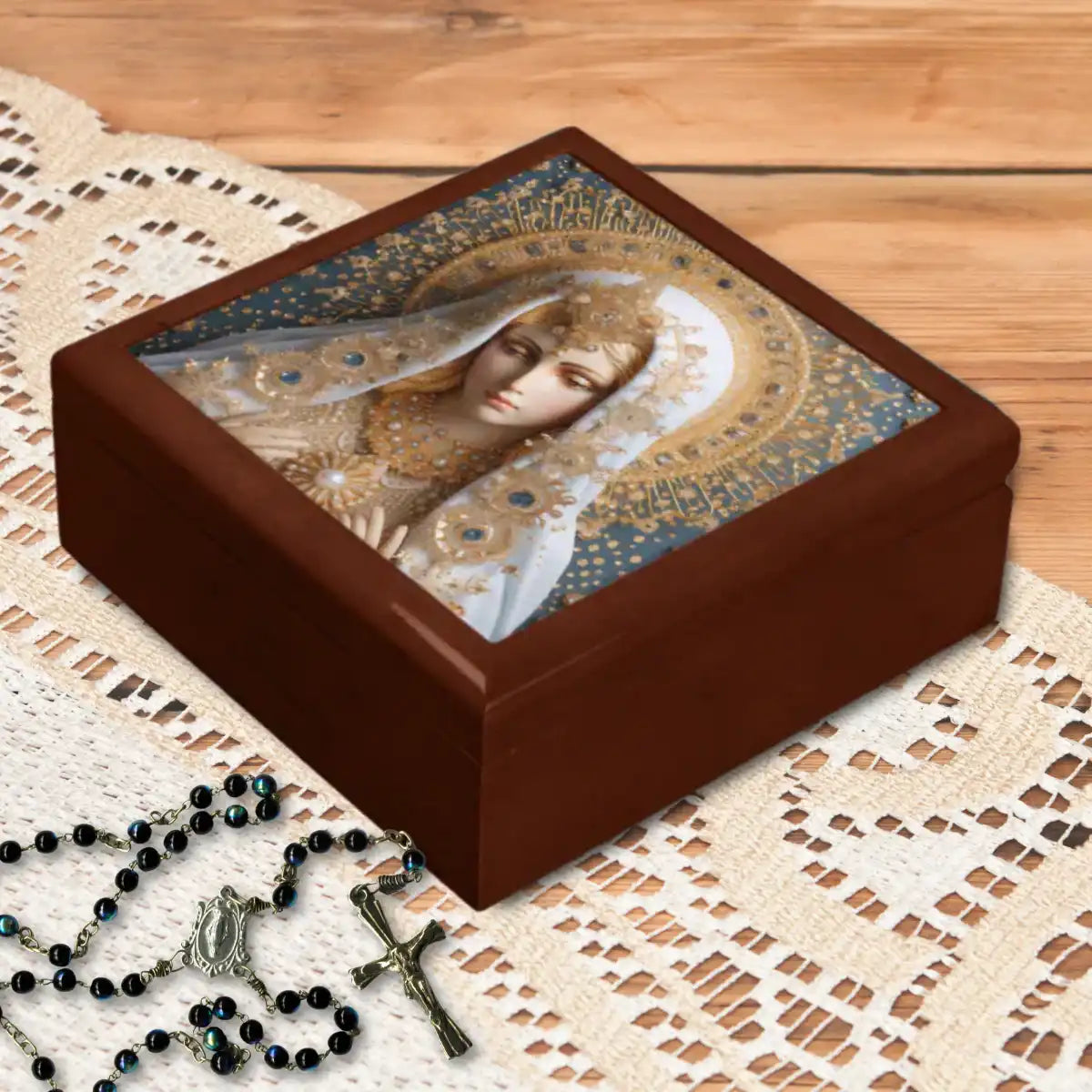 Decorative keepsake box with a religious mother mary design on a lace tablecloth