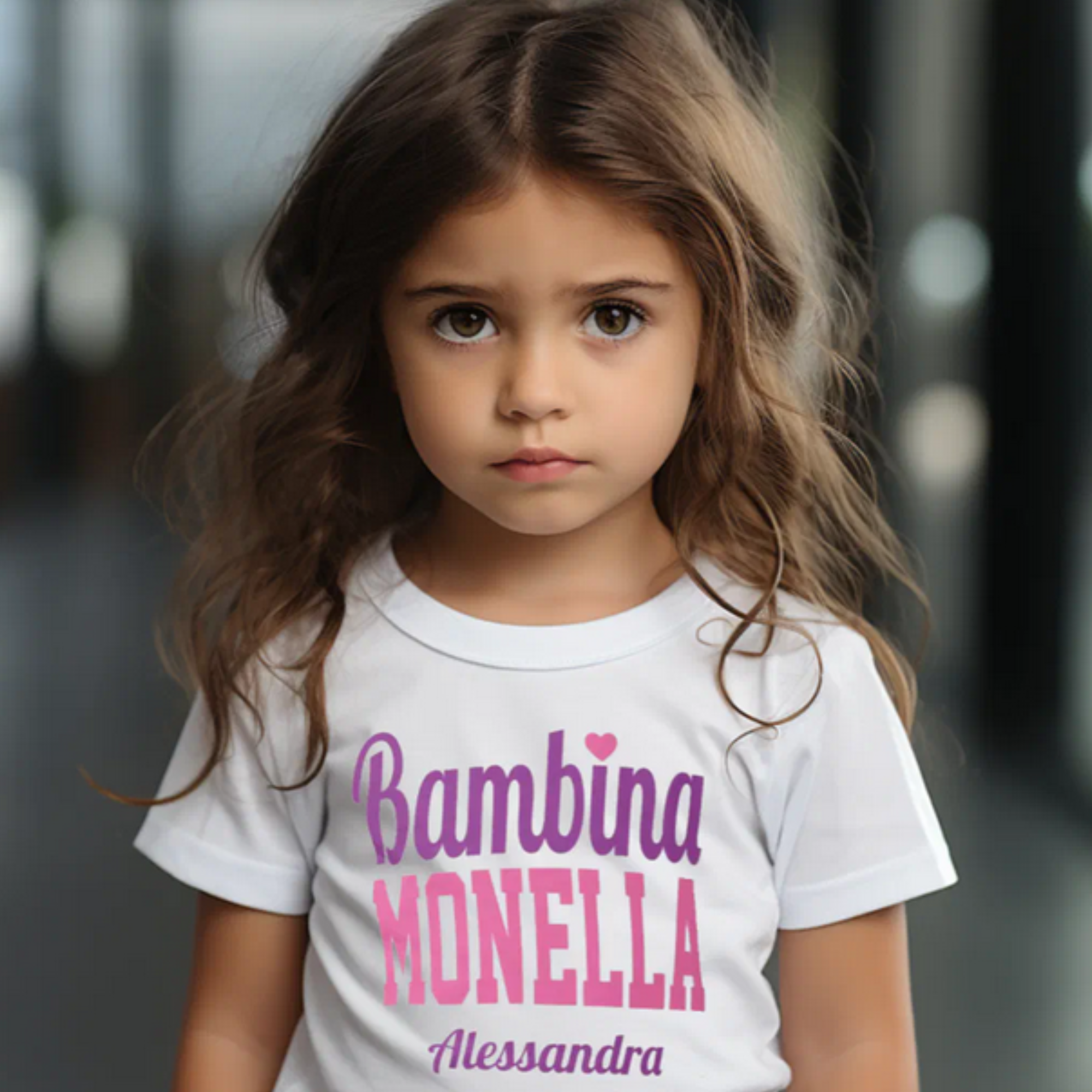 Child wearing white t-shirt with Bambina Monella and personalized custom name, Italian kids gift meaning mischievous little girl, Italian heritage children's apparel, birthday gift, Italian American clothing