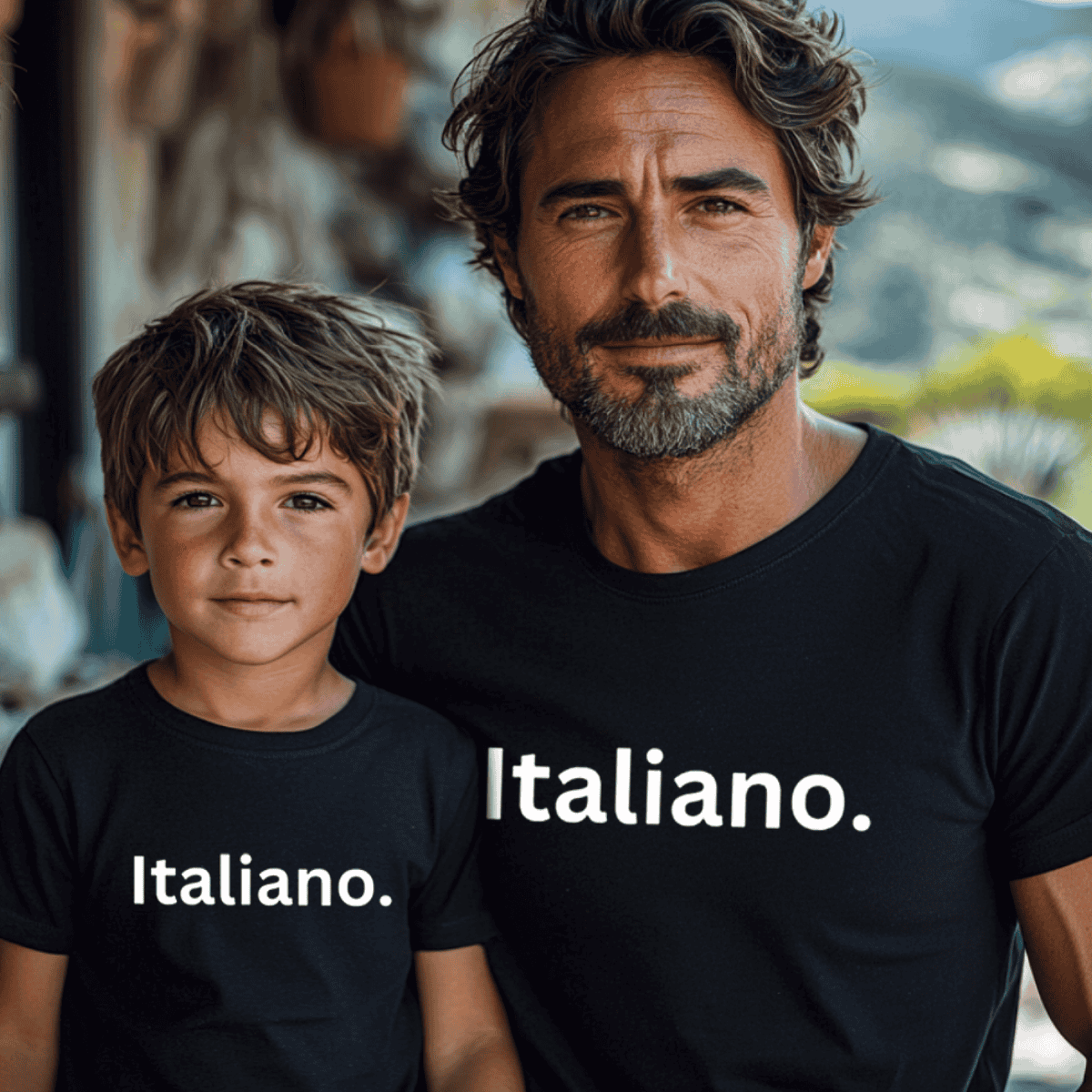 Man and child wearing black shirts with 'Italiano.' text, standing outdoors. Heritage gift for father, gift for boys.