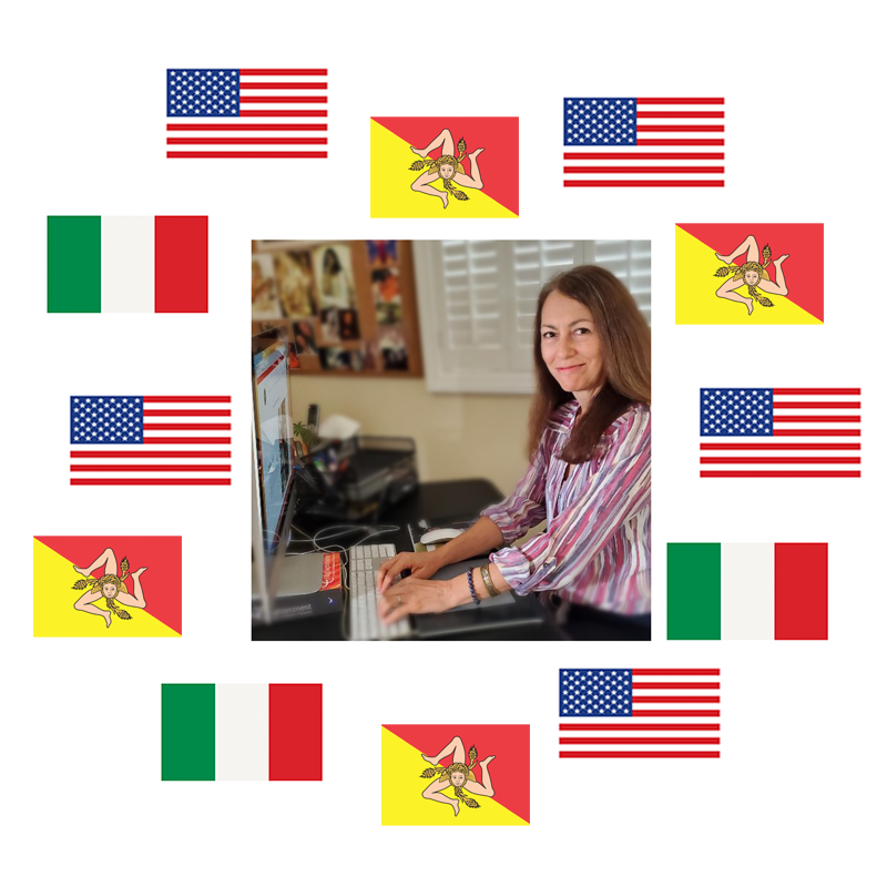 Leandra the creator and artist sitting behind her computer at the desk of italiansiciliangifts.com