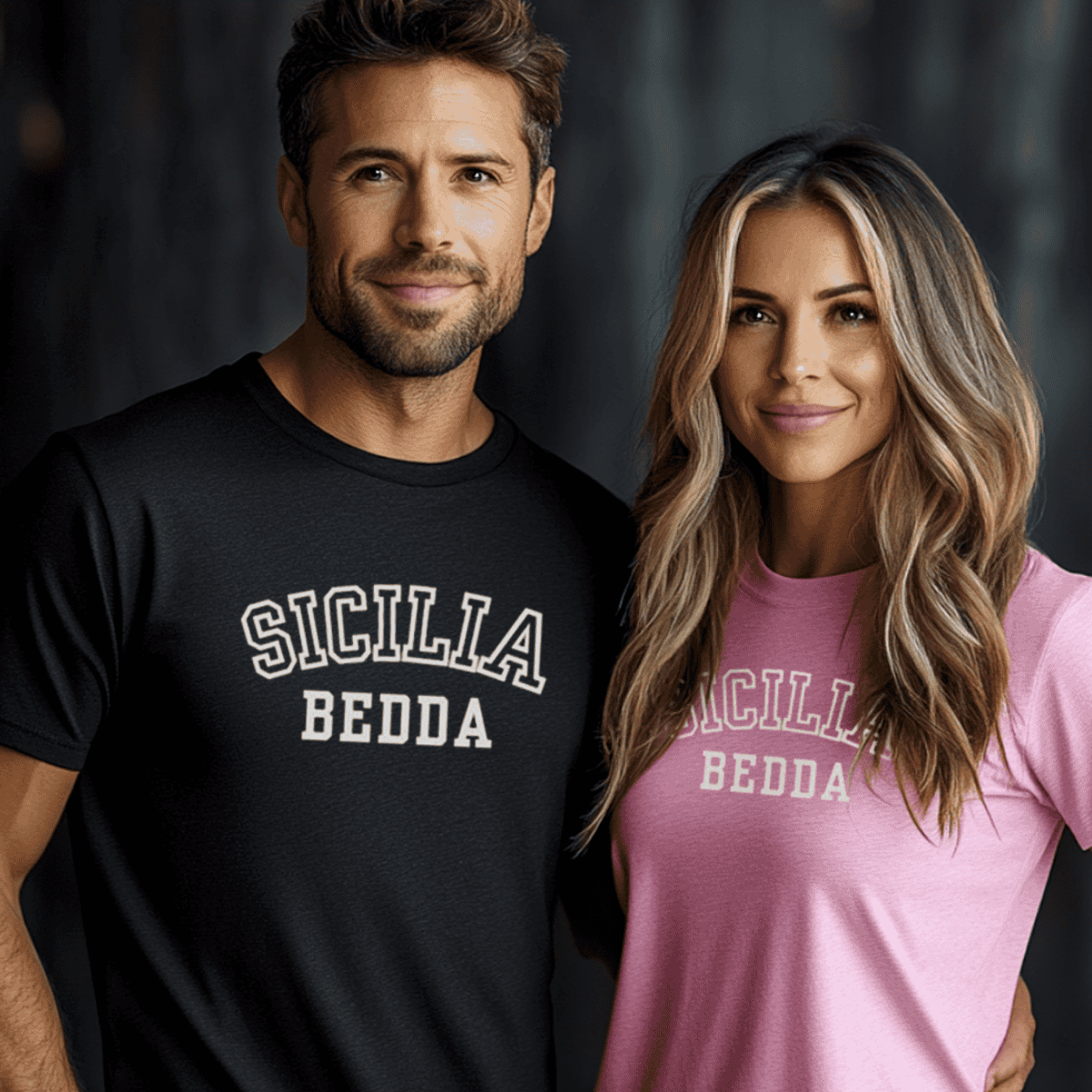 Man and woman wearing matching premium t-shirts with 'SICILIA BEDDA' text available on Amazon. Man in black tee, woman in pink tee.