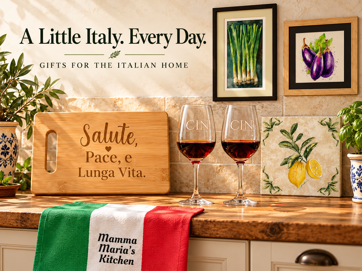 Italian kitchen gifts featuring an engraved Salute, Pace e Lunga Vita cutting board, Cin wine glasses, personalized Italian flag towel, lemon tile and framed vegetable art.