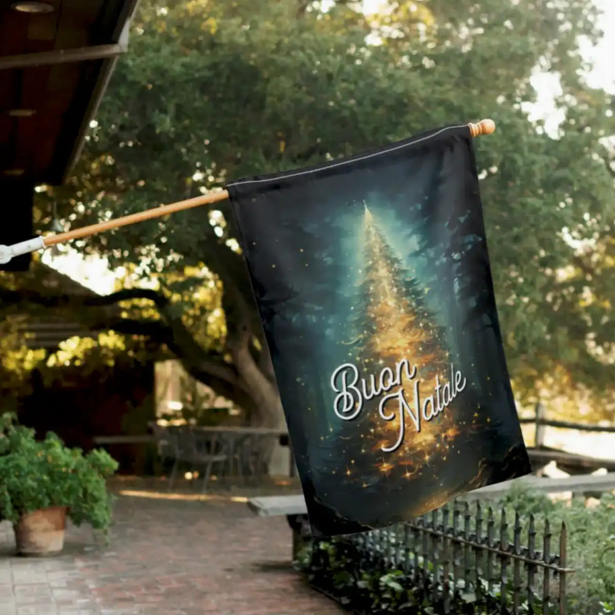 Decorative flag with 'Buon Natale' text and Christmas tree design outdoors.