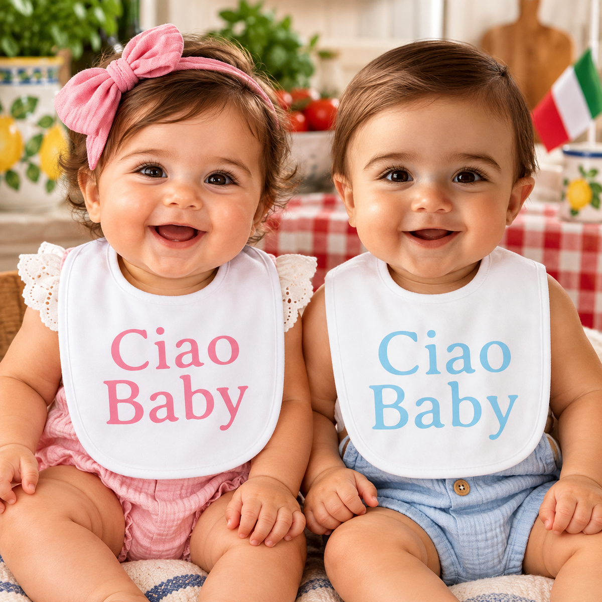 Adorable Italian baby girl and boy wearing matching white “Ciao Baby” bibs with pink and blue lettering. Cute Italian baby shower gifts.