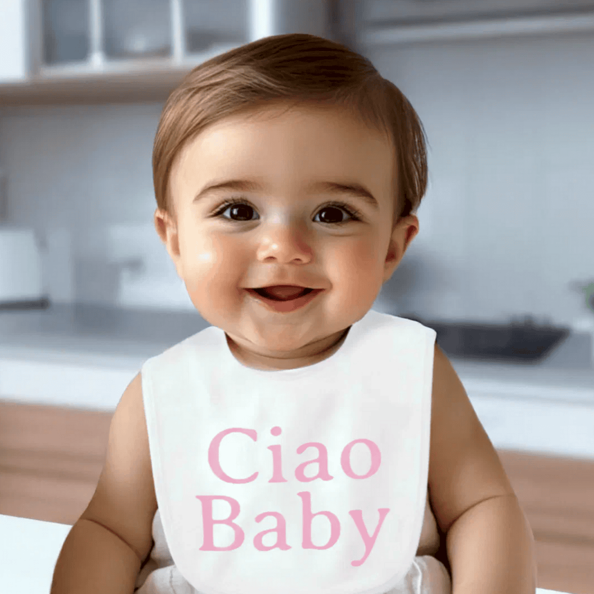 White baby bib with “Ciao Baby” in pink serif font, solid pink back, soft and comfortable, stylish and practical for newborns and baby showers.