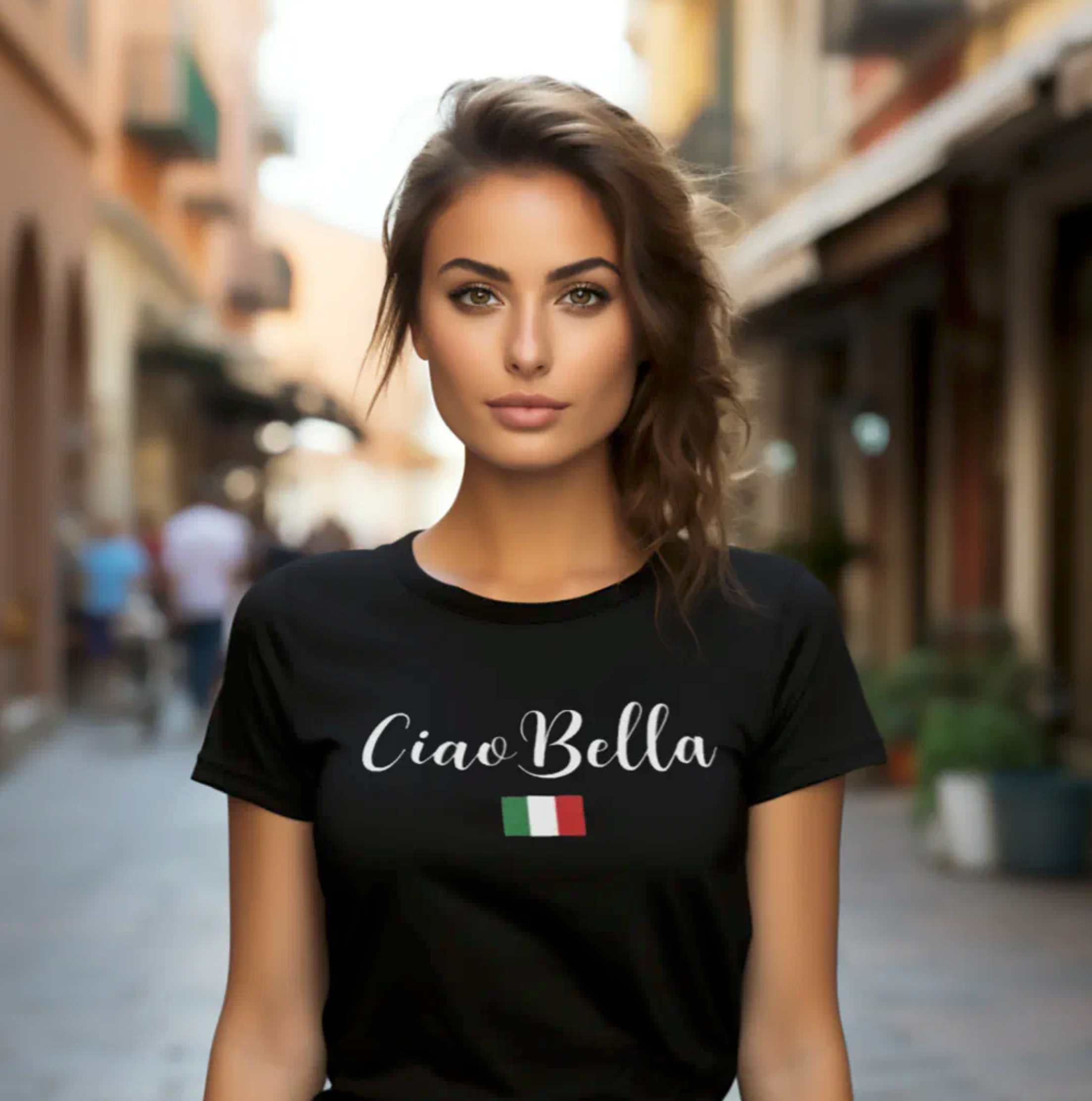 Woman wearing a black t-shirt with 'Ciao Bella' in white script and an Italian flag design. Italian Sicilian heritage gift for her, gift for mom, gift for maid of honor, gift for bridal party, gift for bridesmaids, travel gift.