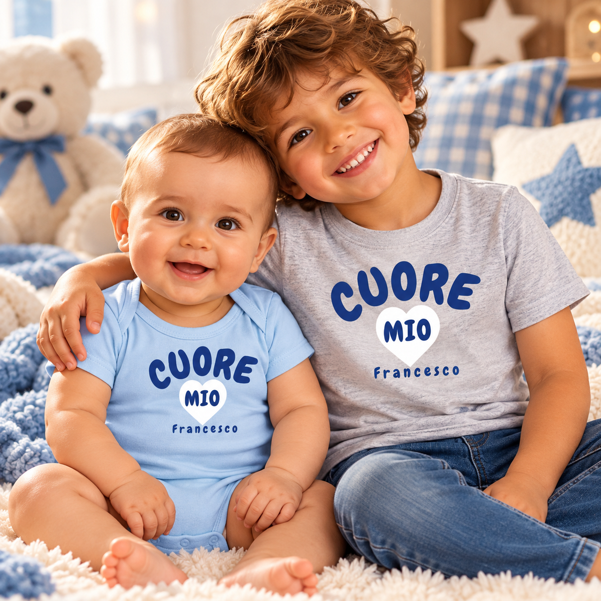 Two brothers wearing personalized Cuore Mio Italian baby bodysuit and kids' T-shirt in blue and gray.
