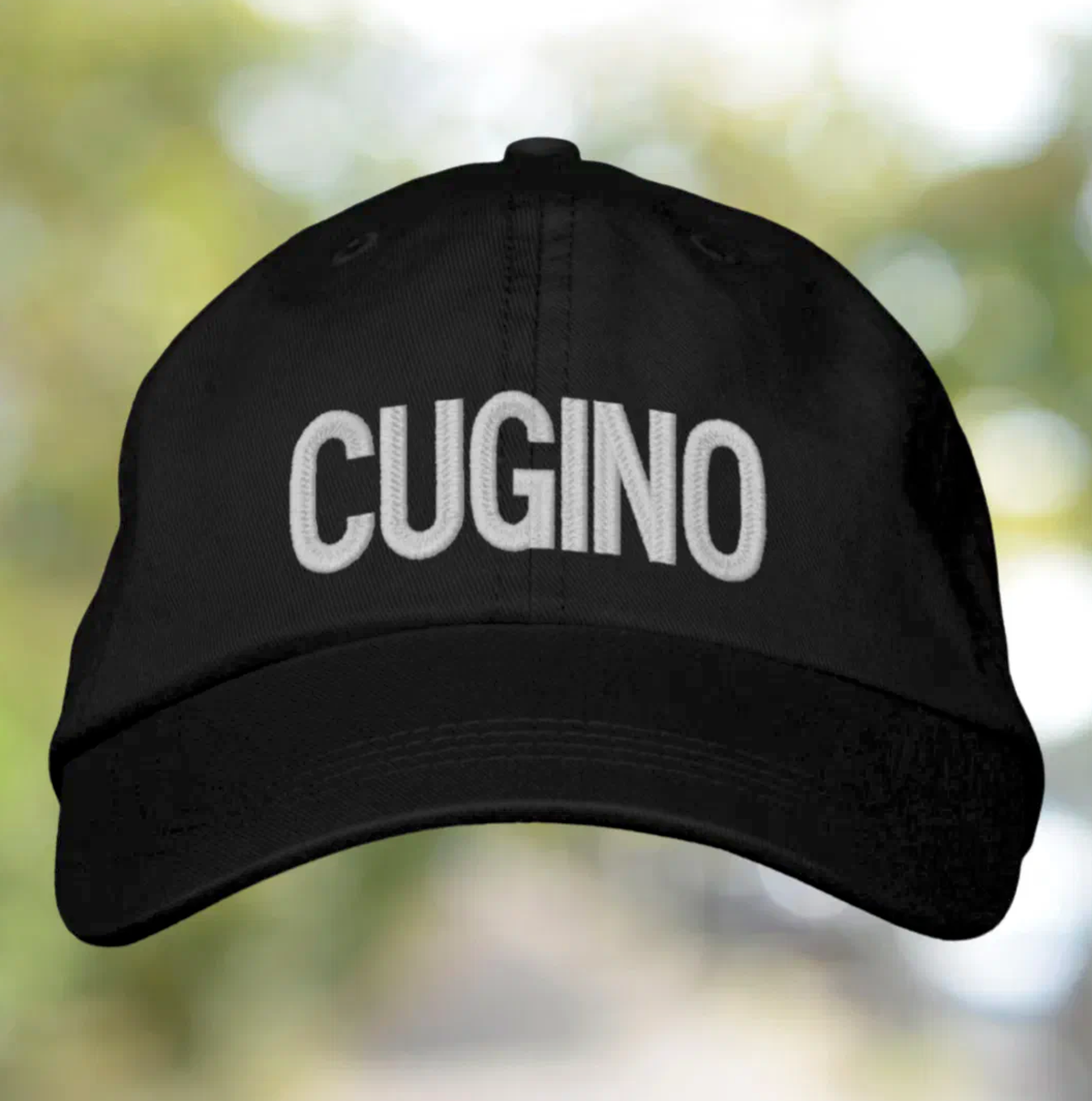 Black cap with 'Cugino' (Cousin) embroidered text. Italian heritage accessory, gift for him, casual headwear, family gift, birthday gift, Christmas gift, and stylish cap for Italian cousin pride.
