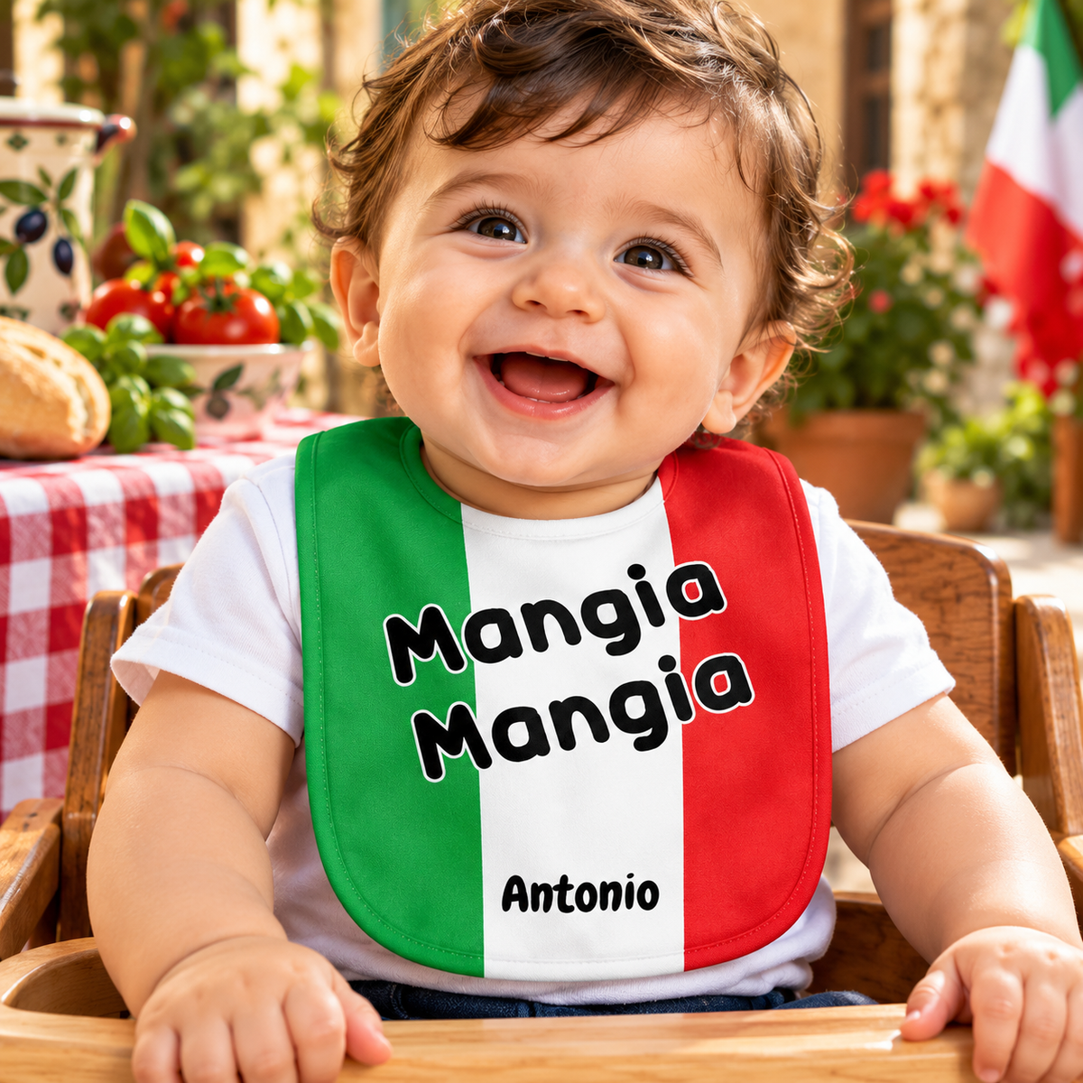 Happy Italian baby boy wearing a personalized “Mangia Mangia” bib with Italian flag colors and the name Antonio. Cute Italian baby shower gift.