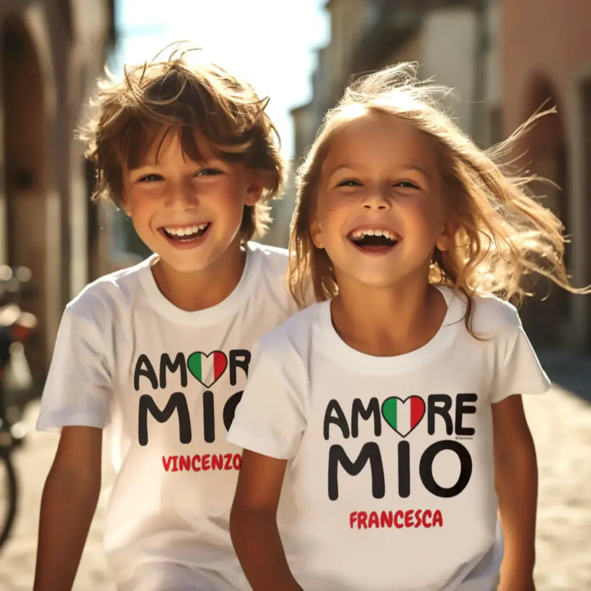 White kids t-shirt with 'Amore Mio' (My Love) featuring Italian flag heart as the 'O' in Amore and dotting the 'i' in Mio, personalized with child's name. Italian heritage kids apparel, gift for kids, custom children's clothing, sibling gift, birthday gift, Christmas gift, and adorable tee for Italian love and pride. 