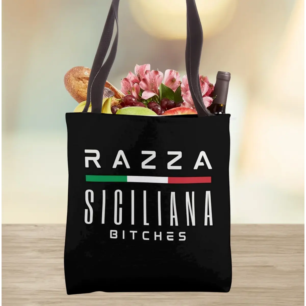 Black tote bag with 'Razza Siciliana Bitches' bold text. Funny Sicilian heritage accessory, gift for her, reusable shopping bag, gym bag, beach bag, and edgy everyday carry for Sicilian attitude. 