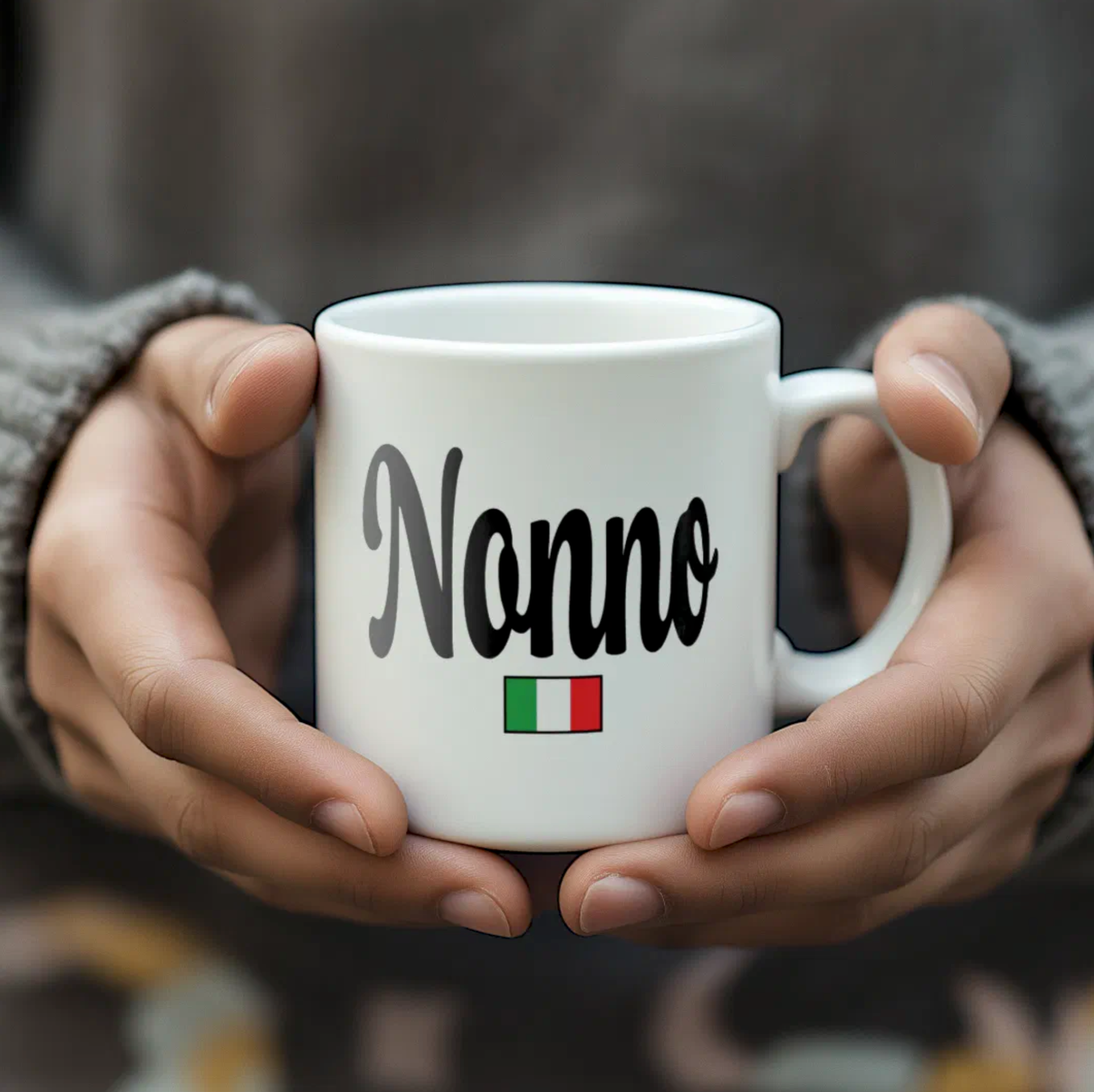 White mug with 'Nonno' and Italian flag held by hands against a blurred background
