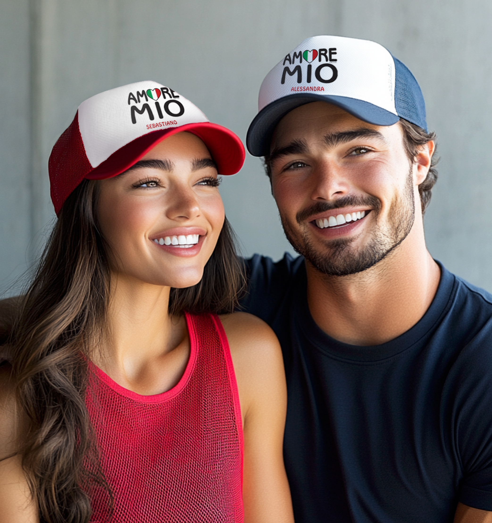 Two people wearing 'Amore Mio' Italian flag heart personalized caps against a neutral background