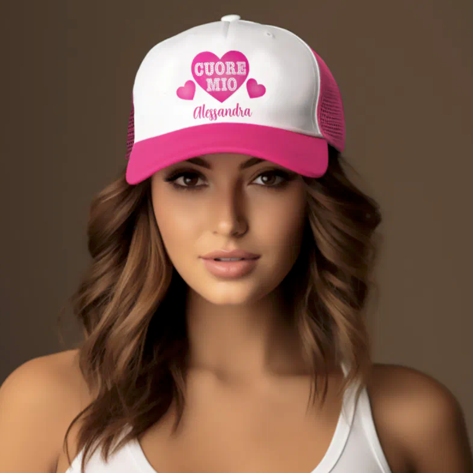 Woman wearing a pink and white cap with 'CUORE MIO' personalized text.