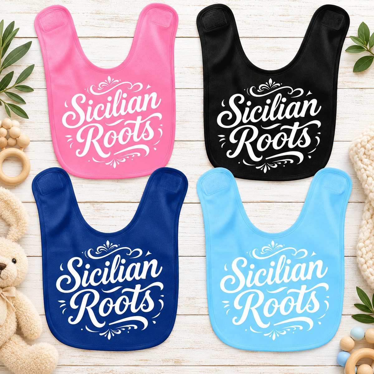 Sicilian Roots baby bibs in pink, black, navy blue, and light blue with white lettering. Cute Italian heritage gifts for babies.