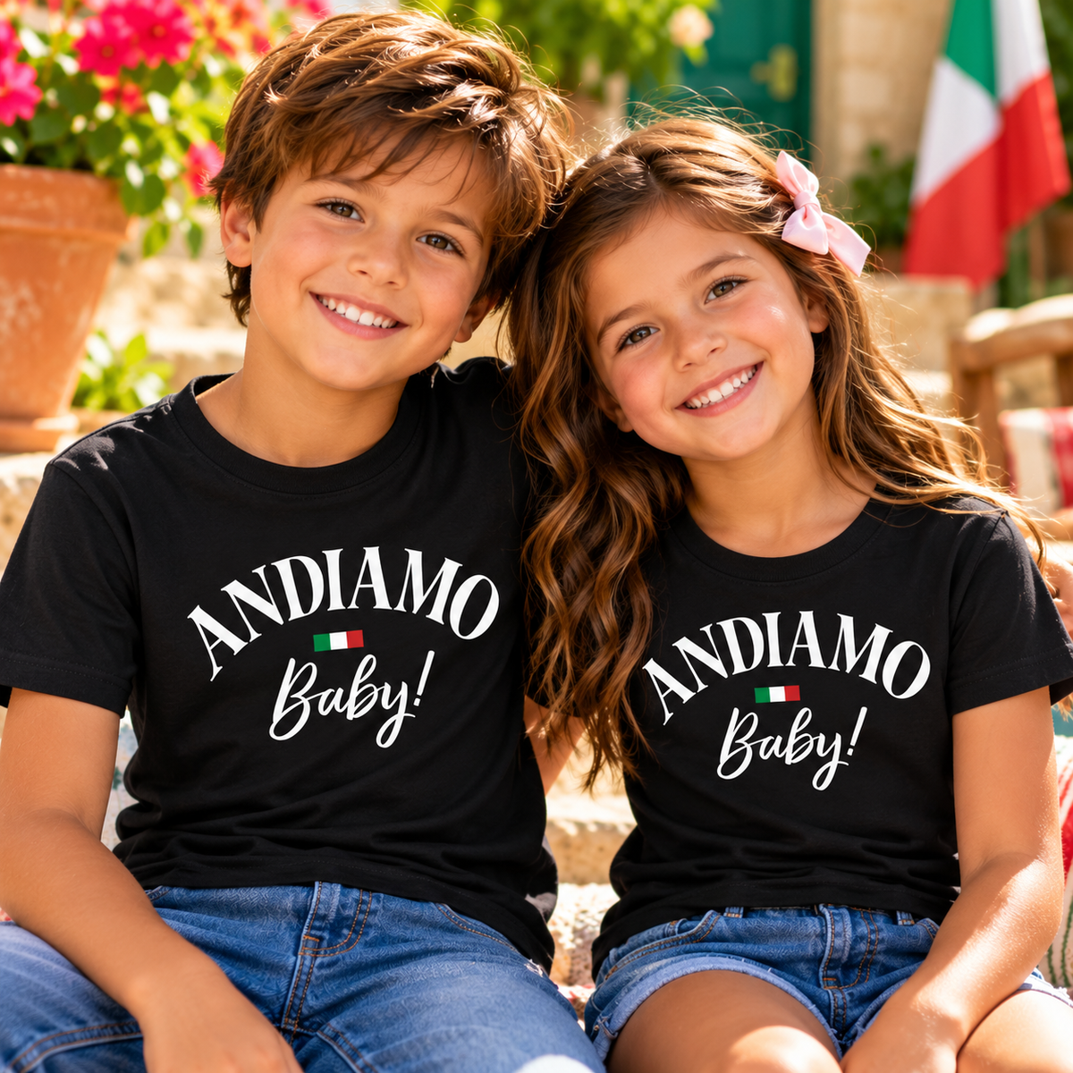 Brother and sister wearing matching black “Andiamo Baby!” Italian heritage T-shirts with Italian flag accents. Fun Italian-American kids’ shirts for family vacations, Italy travel, reunions and celebrating Italian roots.