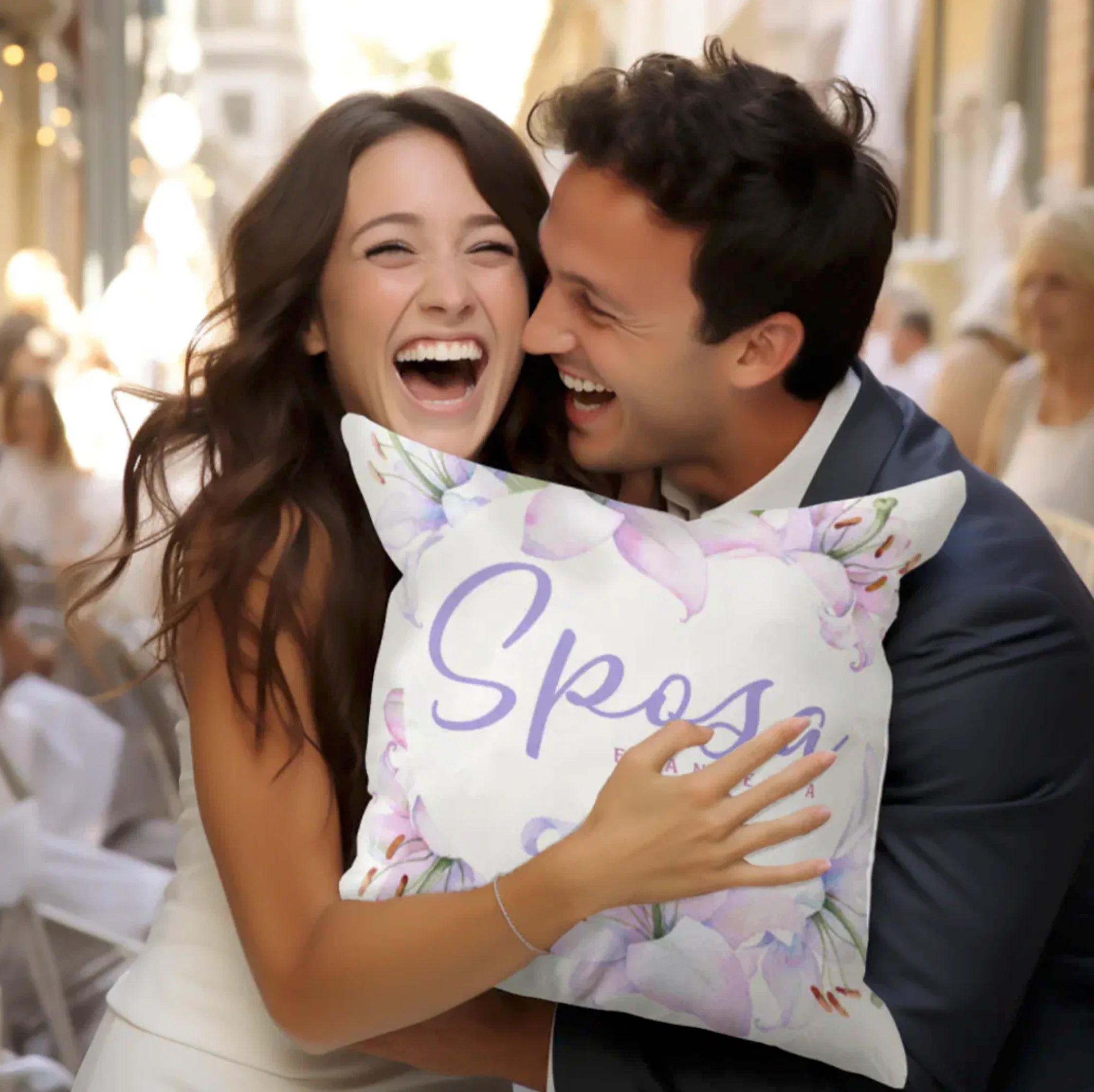 Couple holding a pillow with floral design and 'Sposa' in lavender script; personalized bridal party pillows collection for Italian weddings. A unique keepsake gift from your wedding for family members link nonna, zia, mamma, padrina.