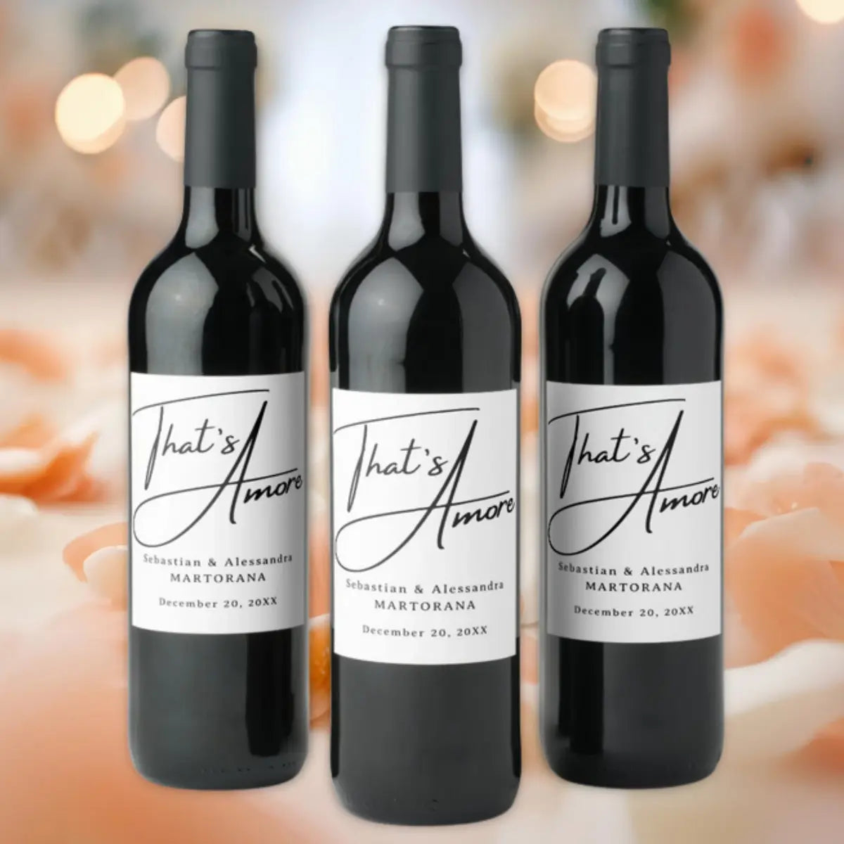 Three wine bottles with That's Amore labels personalized with couples names and wedding anniversary or engagement date - Italian table decor.