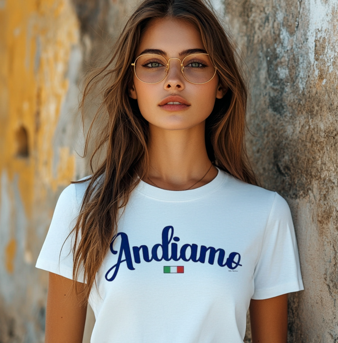 Woman wearing white Andiamo t-shirt with Italian flag against textured wall - Italian let's go phrase apparel gift.