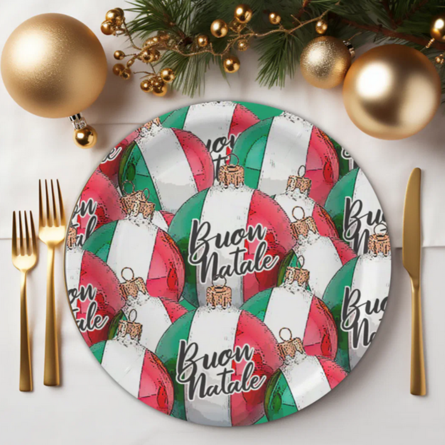 Decorative plate with Christmas ornaments and 'Buon Natale' text, surrounded by gold ornaments and cutlery.