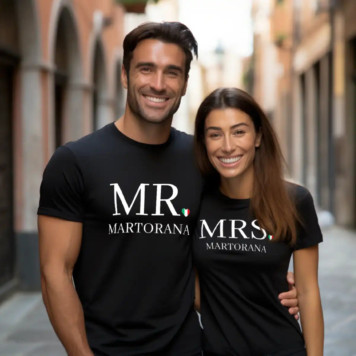 Couple wearing matching black MR and MRS personalized last name t-shirts with Italian flag heart as period, Italian wedding gift, bride and groom gift, honeymoon gift, anniversary gift, personalized couple apparel