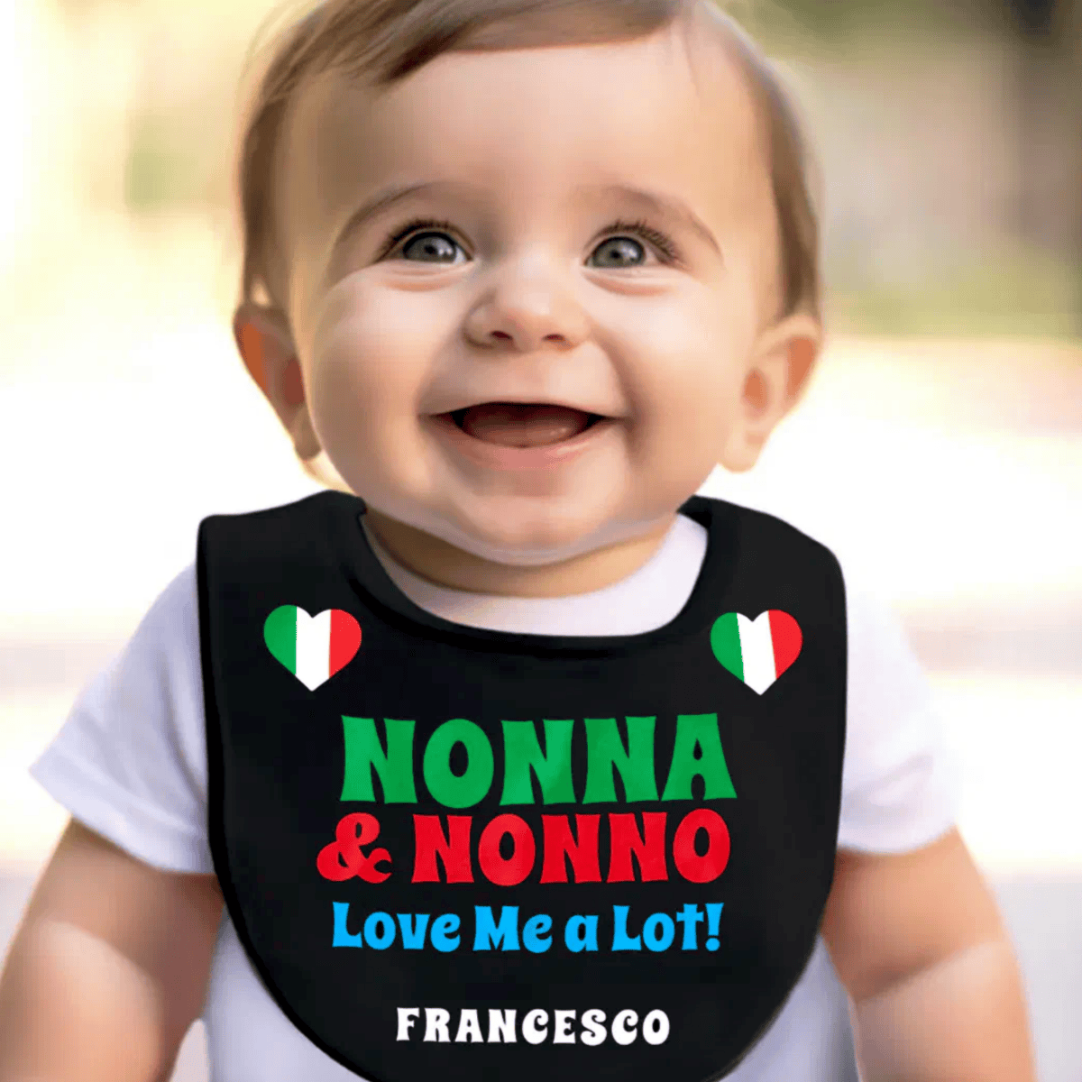 Baby wearing a bib with Nonna and Nonno love me. Personalized heritage gift for baby