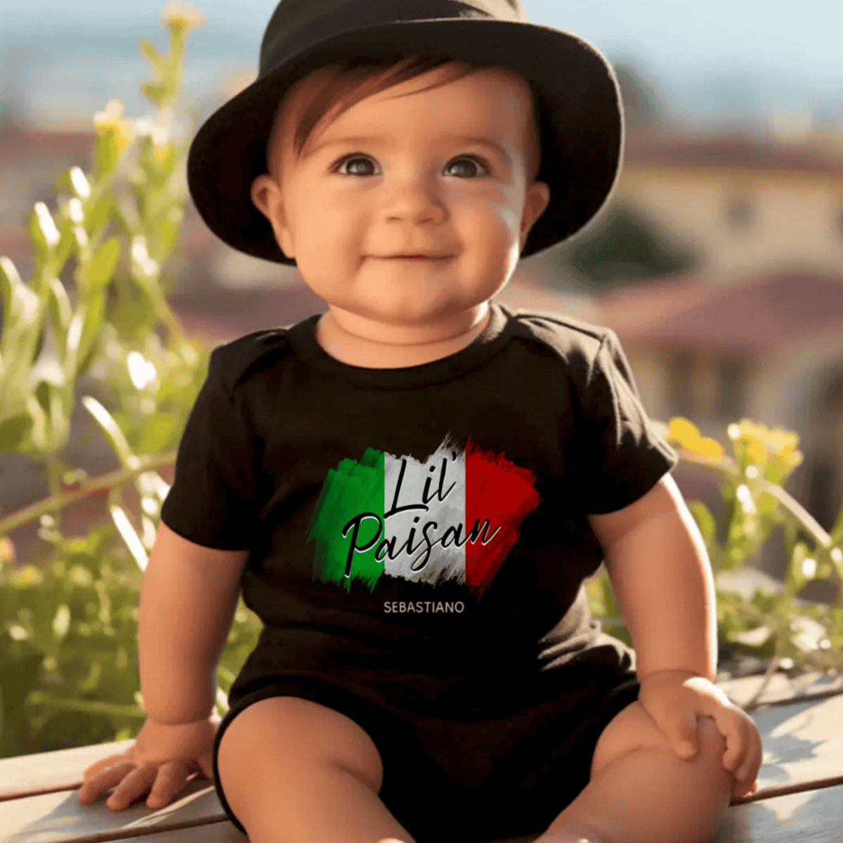 Baby wearing a black bodysuit with Italian flag Lil' Paisan design - Personalized heritage gift
