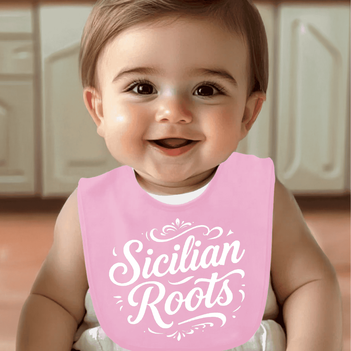 Baby wearing a pink bib with 'Sicilian Roots' text - Italian heritage gift for baby