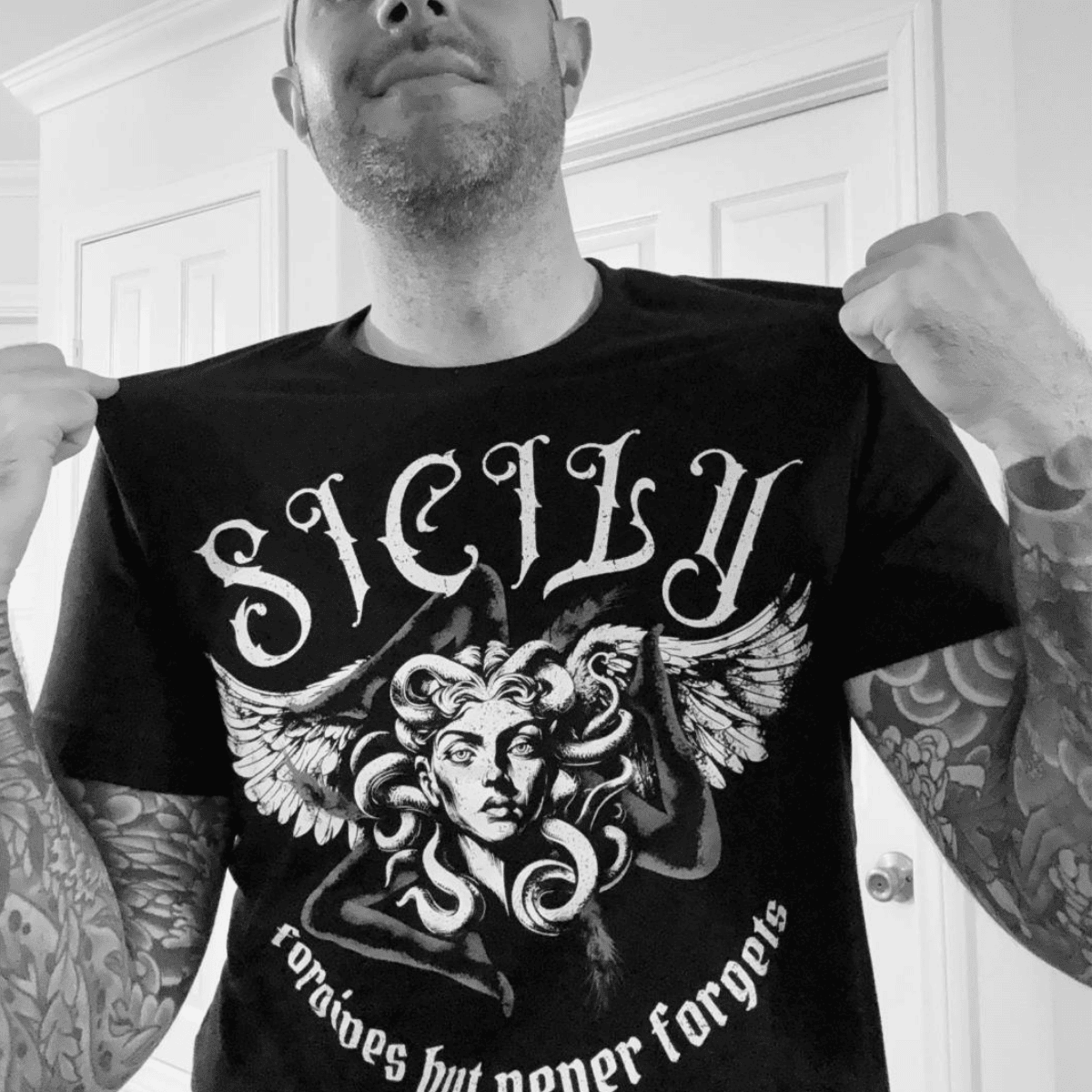 Cousin Joe wearing the Siciliy Forgives but Never Forgets t-shirt